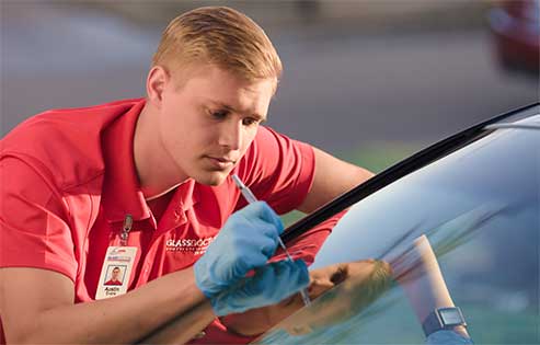Glass Doctor specialist repairing a windshield crack